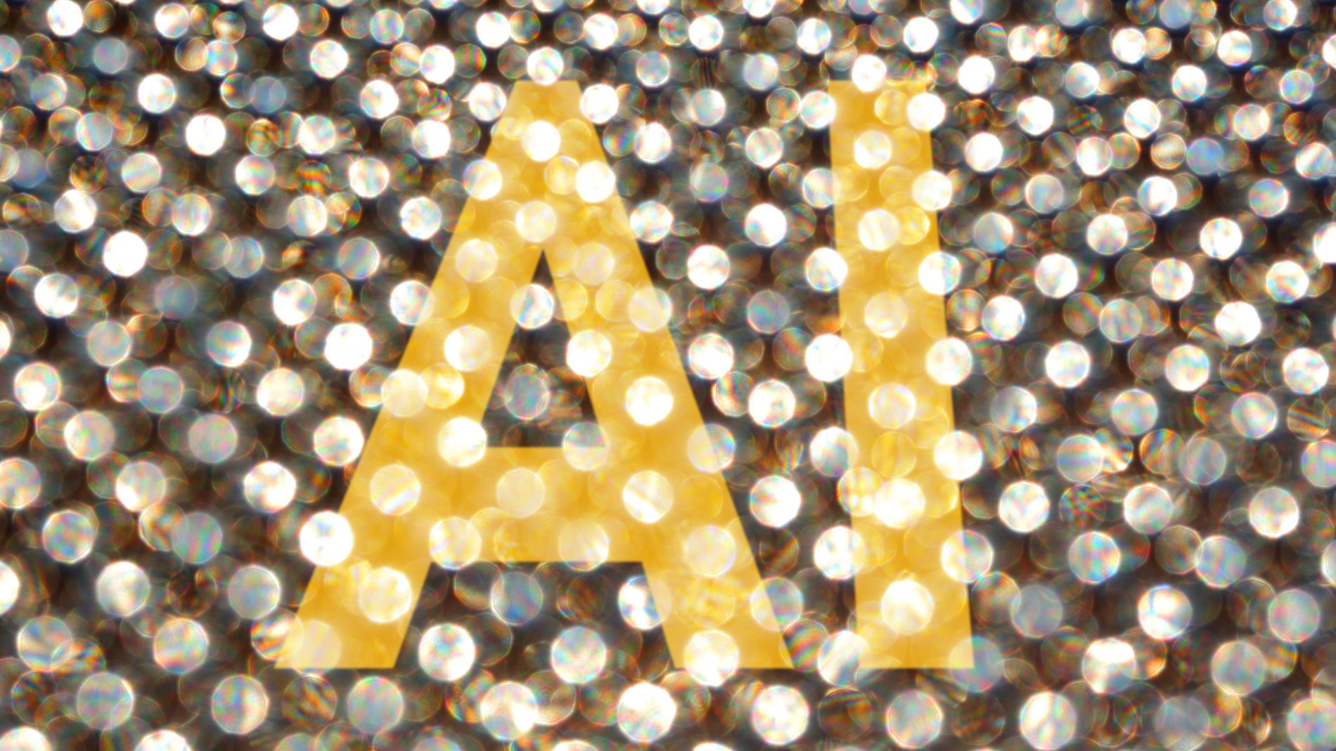 Goldene Buchstaben „AI“ vor funkelndem Hintergrund