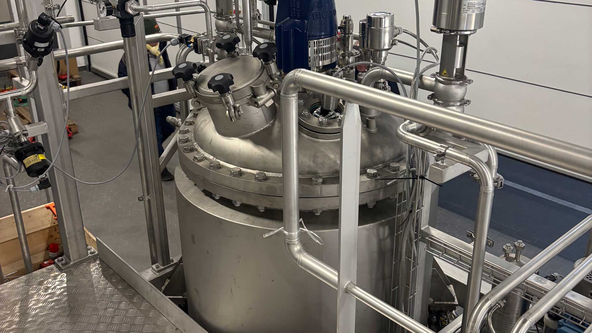 Industrial fermenter processing plant-based by-products