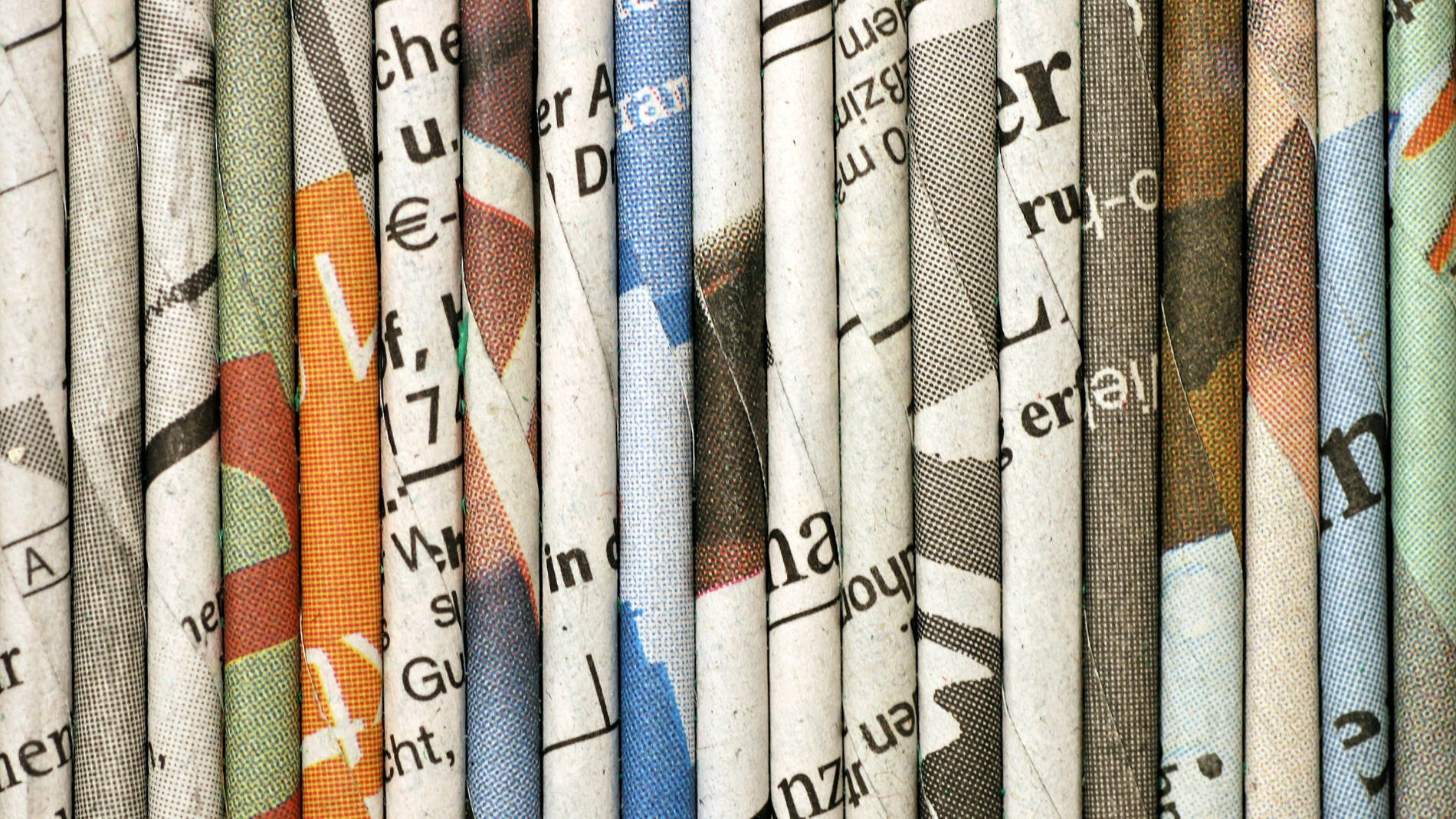 Various folded newspapers