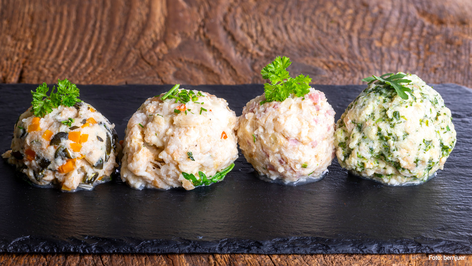 Four dumplings on a slate plate